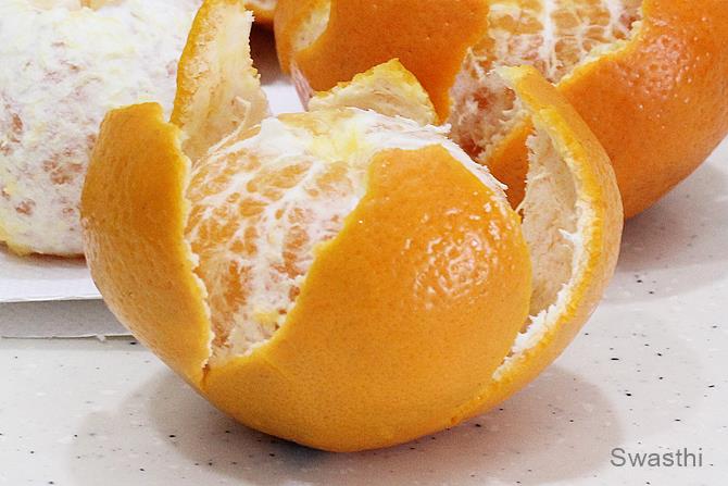 peeling rind of oranges