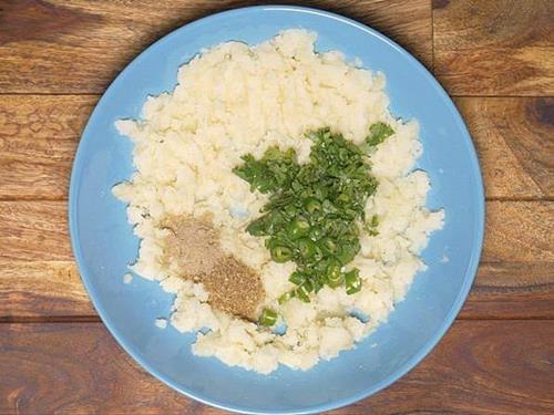adding chopped coriander leaves green chilies