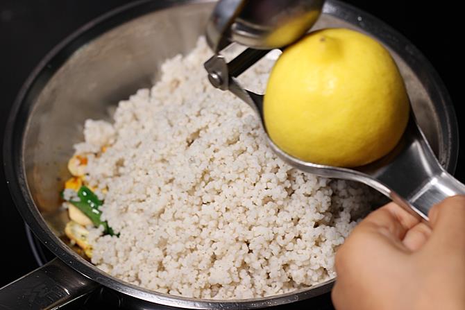 squeezing lemon juice on cooked millets