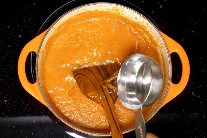 pouring water to simmer gravy