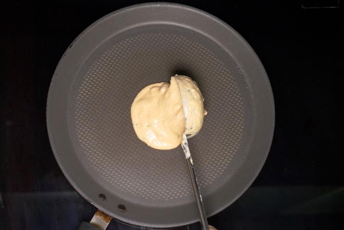 grease pan and spread batter to make adai recipe