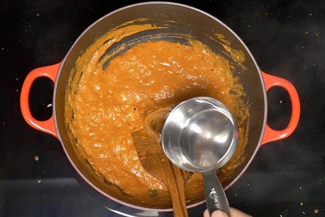 Pour water to make paneer lababdar