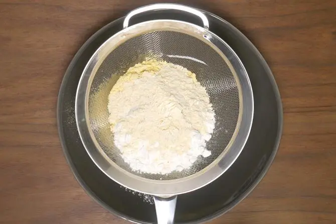 Sieve together besan, rice flour, fried gram powder