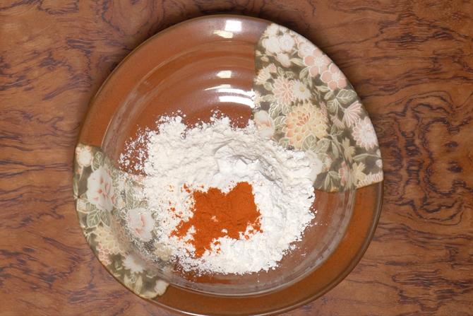 adding flour chili salt to make paneer manchurian