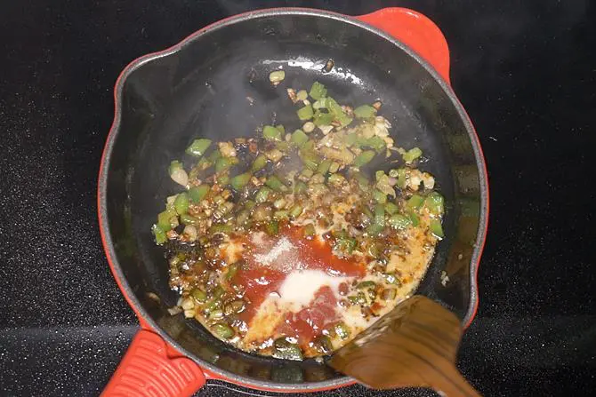 pouring corn starch to make paneer manchurian