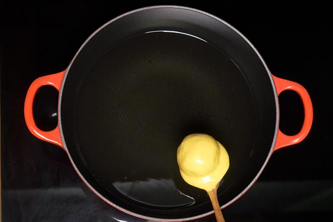 drop the batter coated ball in oil