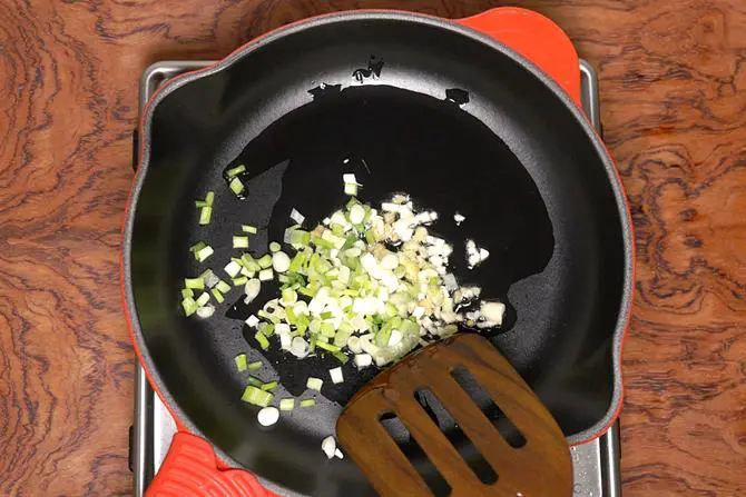 frying spring onions for mushroom manchurian