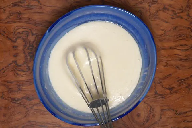 whisk wet ingredients to make eggless sponge cake batter