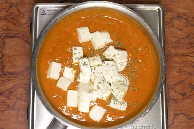 adding paneer to make paneer do pyaza