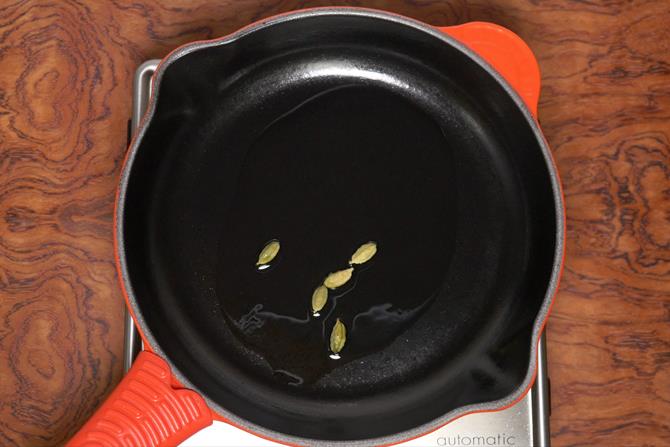 sauteing spices to make chicken korma