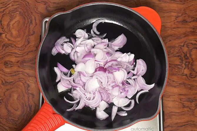 adding onions to make chicken korma