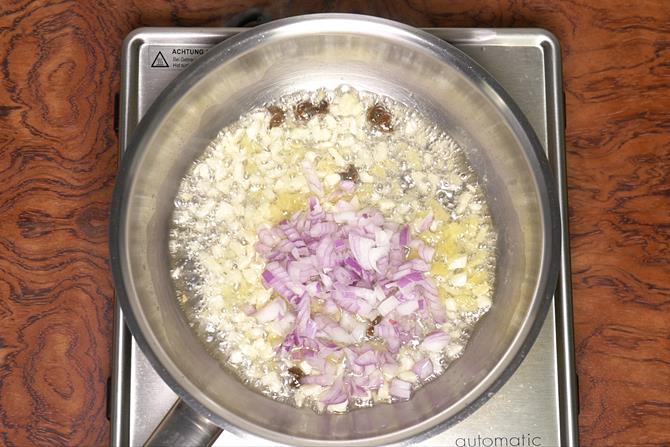 adding onions to make schezwan sauce