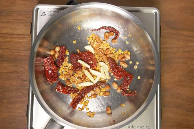 frying garlic in pan to make onion chutney