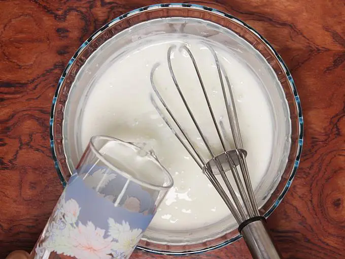 pouring water to make lassi