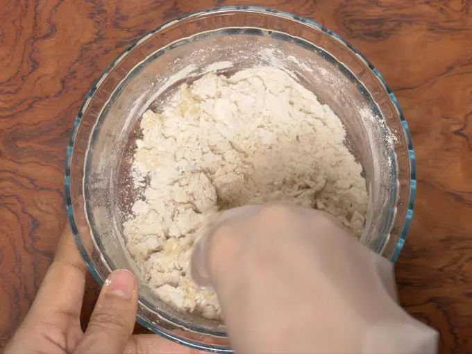 mixing the flour to make dough