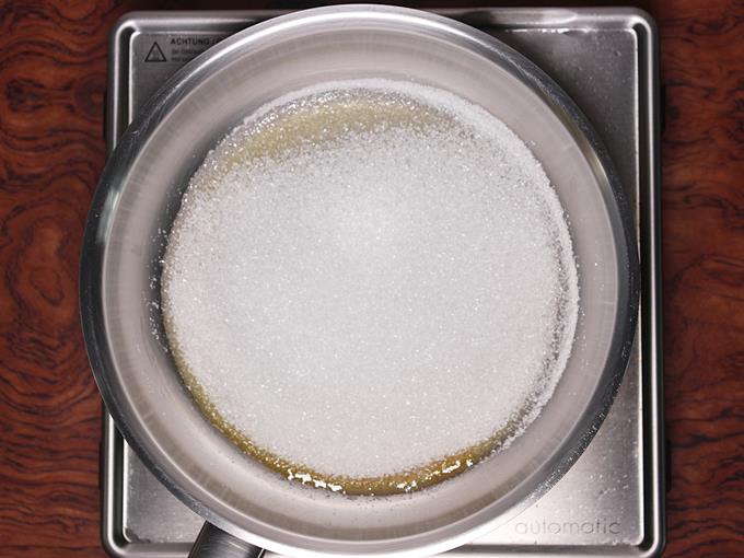 Adding sugar to a pan