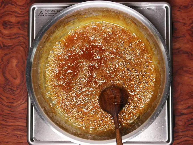 stirring sugar to make praline