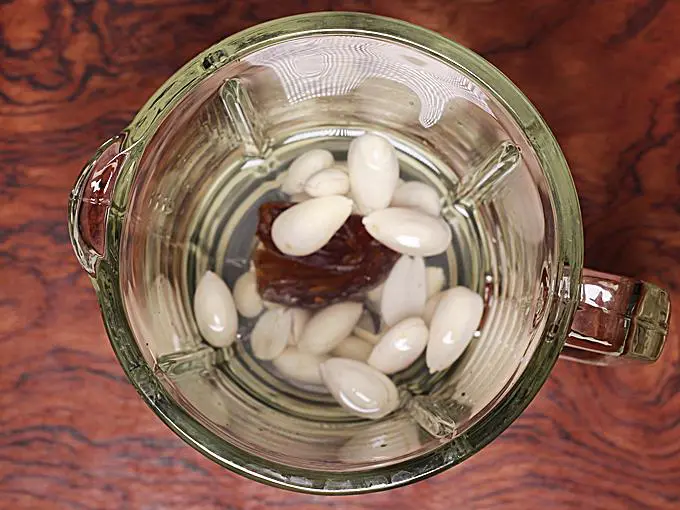 pouring water or milk to make banana shake