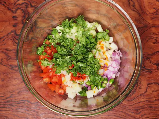 adding coriander leaves for jhal muri