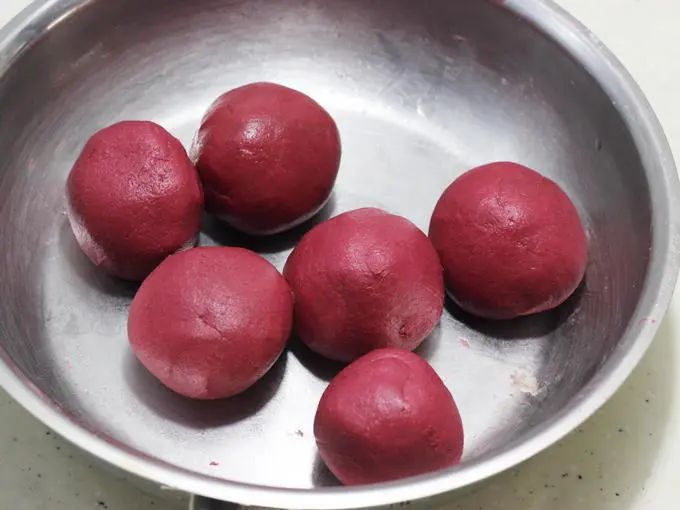 Divide the beetroot paratha dough