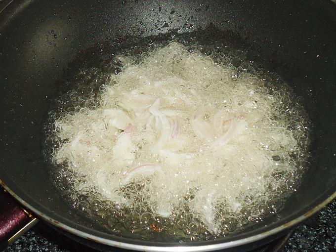 making fried onions to make mutton korma