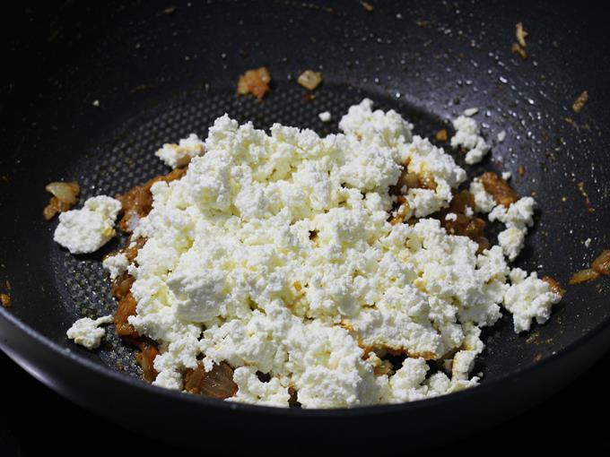 adding crumbled paneer