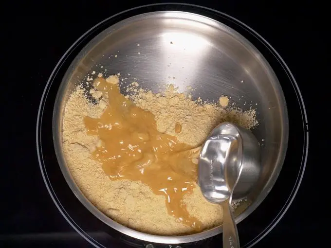 adding jaggery water for aval payasam recipe