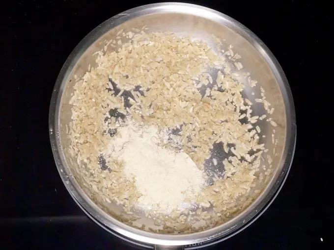 frying powder in ghee to make aval payasam
