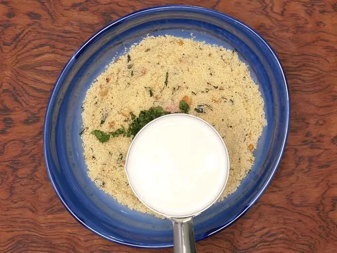 adding curd to semolina