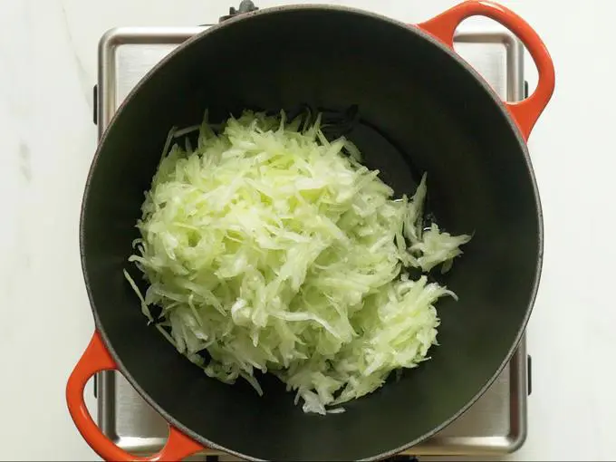 frying bottle gourd in ghee to make lauki ka halwa