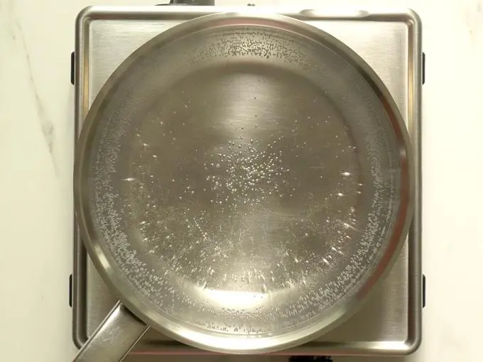boiling water in a pot for rava kesari recipe