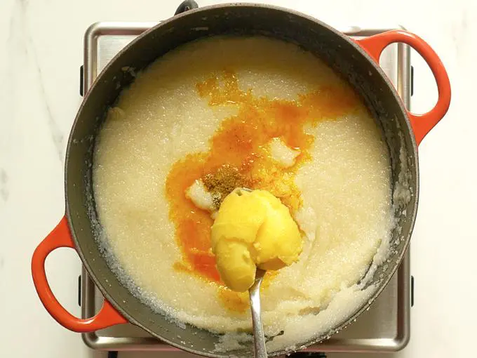 pouring ghee to rava kesari