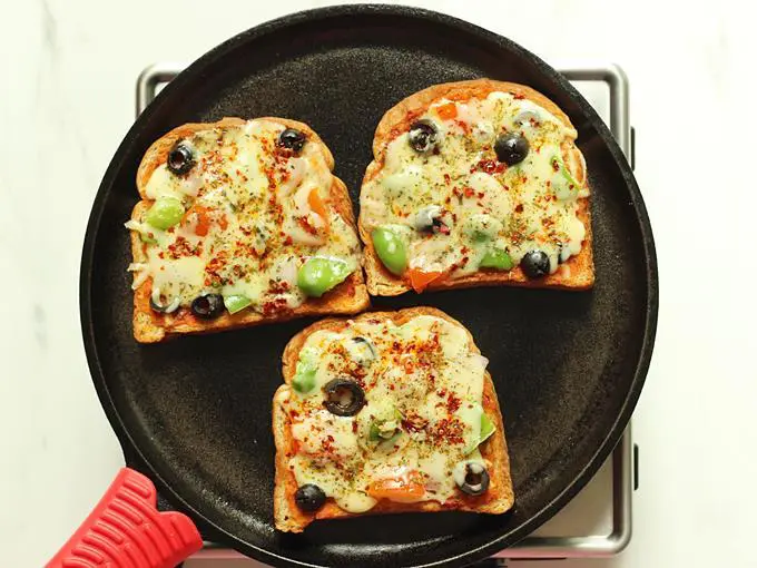 cheese melts on bread pizza