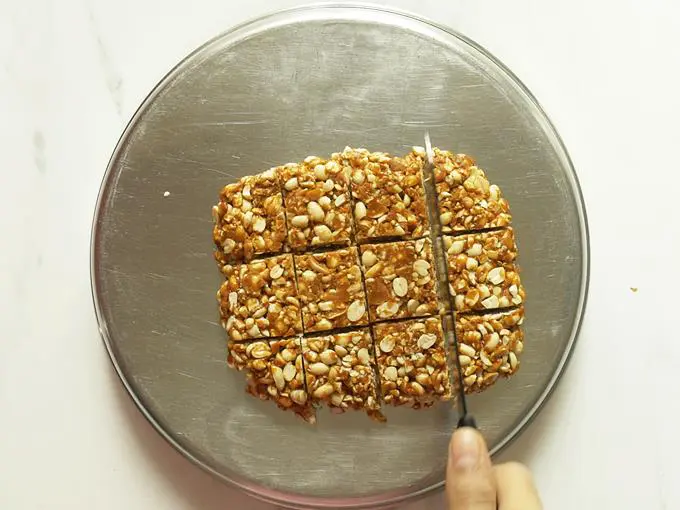 make marks over mixture to make peanut chikki