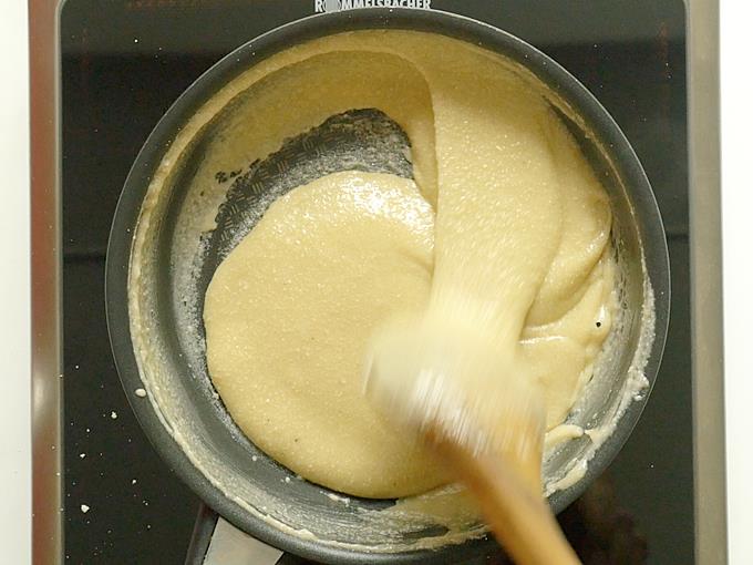 Stir continuously until kaju katli mixture thickens