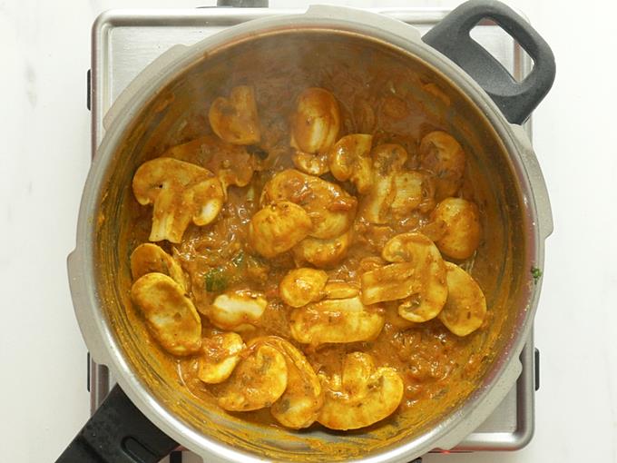 frying mushrooms to make mushroom biryani