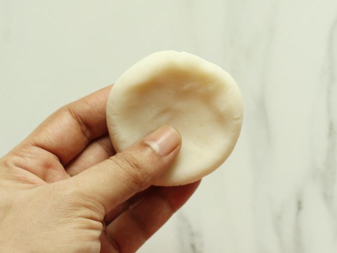 spread the dough to a thin puri