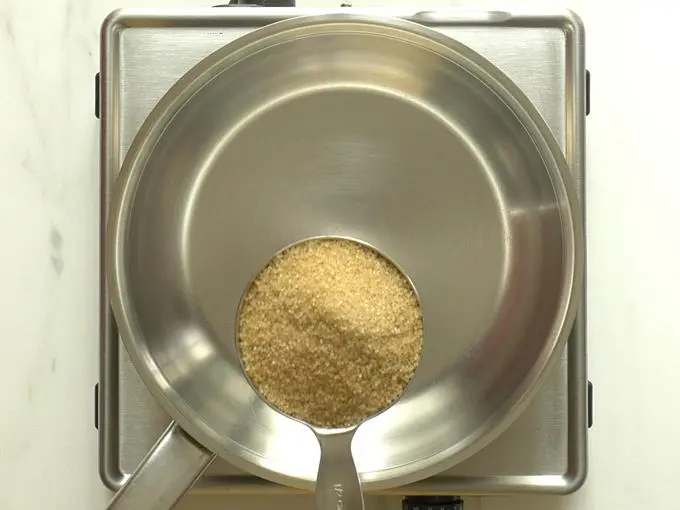 adding sugar to make sugar syrup for seviyan