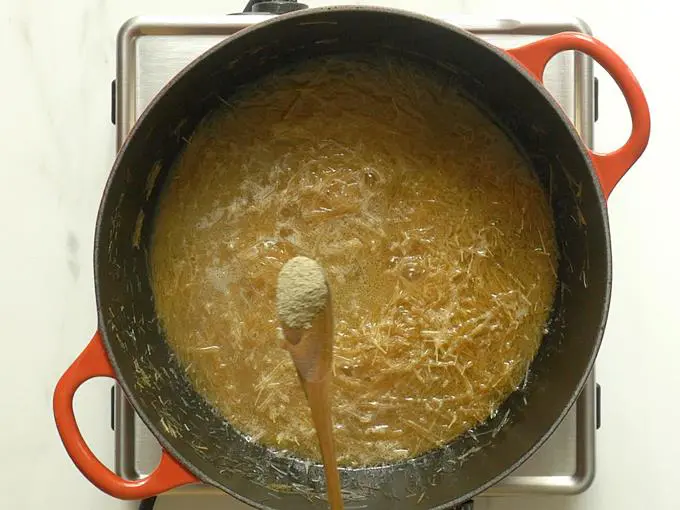 adding cardamom powder