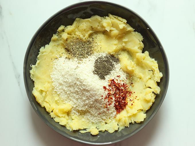 Adding bread crumbs & spices to cheese ball mixture