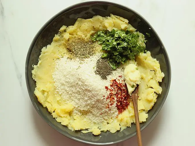 adding garlic to the mashed potatoes