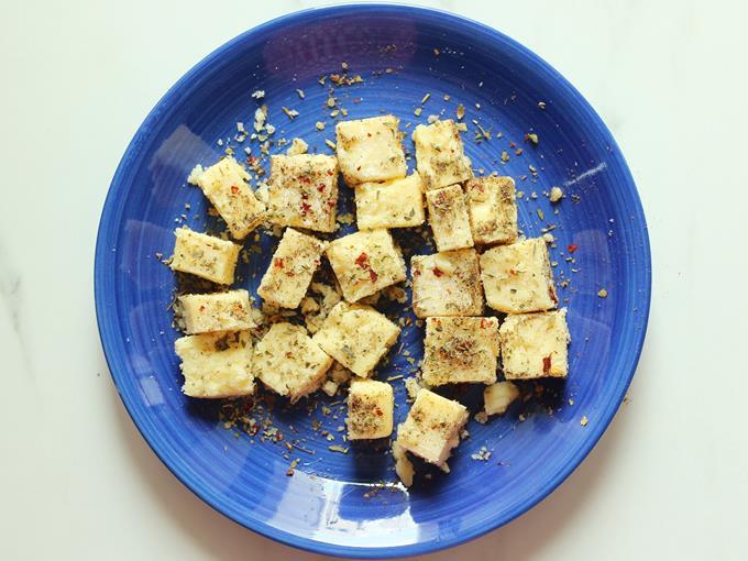 toss cheese cubes in spice mix to make cheese balls