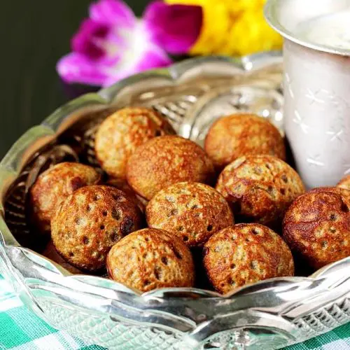 sweet paniyaram offered to god in a silver plate