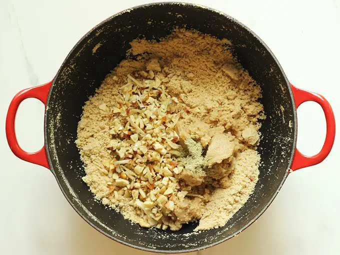 Add the nuts, cardamom powder