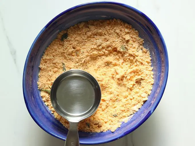 pouring more water to make nippattu dough