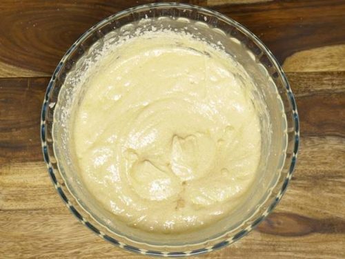 creamy butter sugar and eggs in a bowl to make banana cake batter
