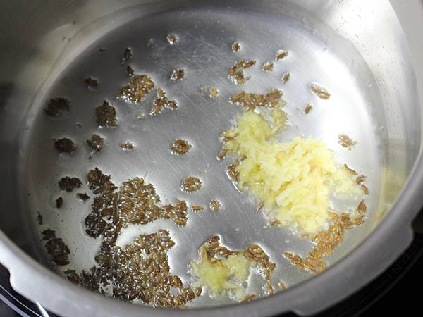 frying ginger bay leaf to make dalia recipe