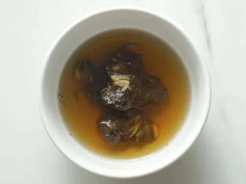 soaking tamarind in water to make ginger chutney