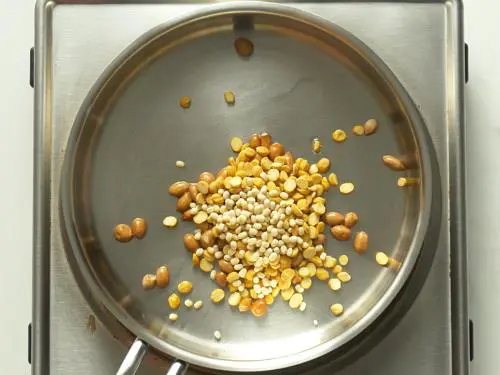 frying dal peanuts to make ginger chutney
