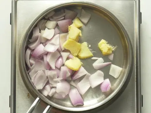 frying onions ginger to make allam chutney